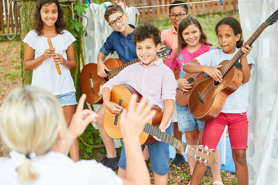 Children's Band and Teacher Rehearse for the Performance