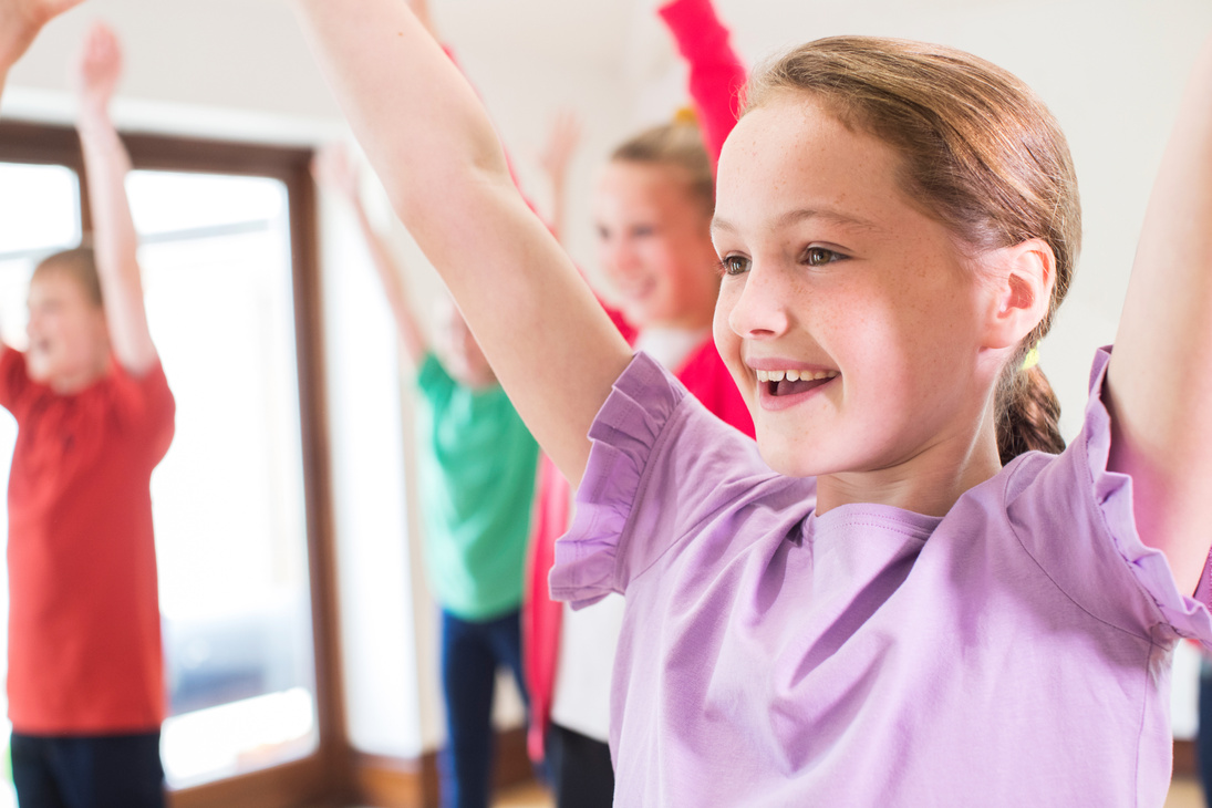 Group Of Children Enjoying Drama Class Together